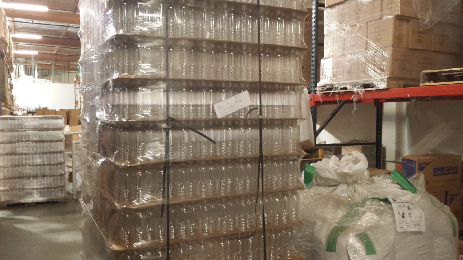 Empty bottles staged for filling and private-label packaging at Minimus Products
