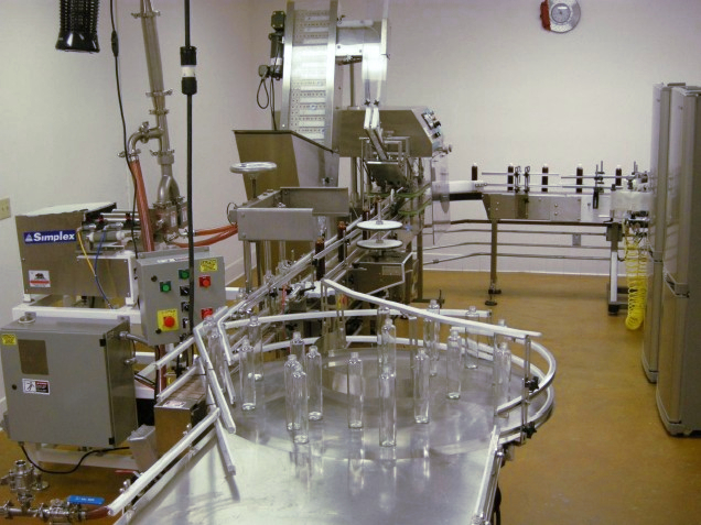 Liquid bottle filling line at Minimus Products contract packaging facility