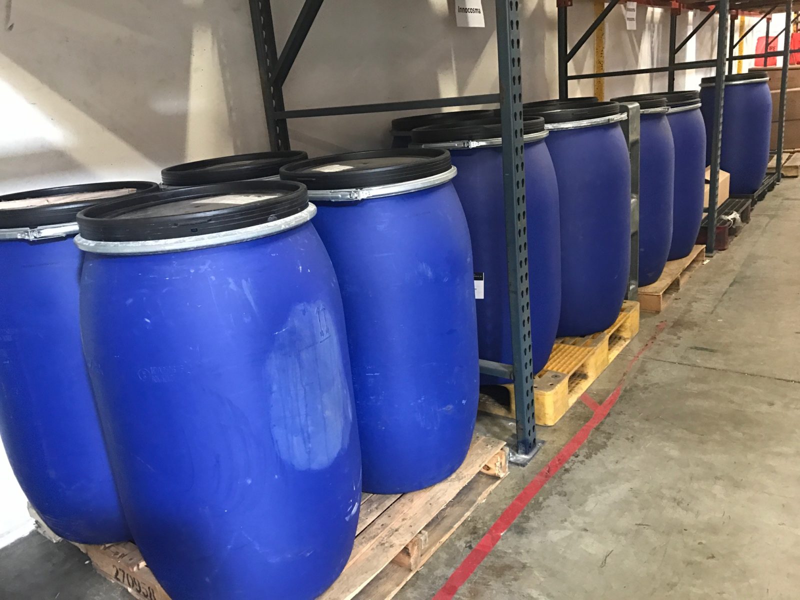 Bulk food ingredient drums staged in the Minimus Products warehouse